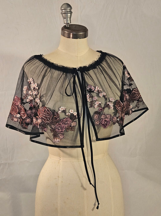 Short black mesh cape with pink floral embroidery