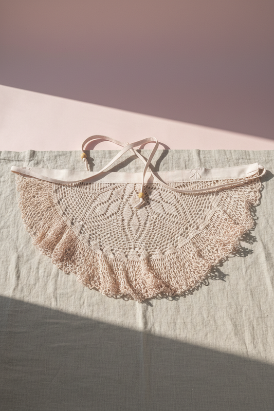 Avacado pink dyed Crochet hair scarf with a tie. Flat view