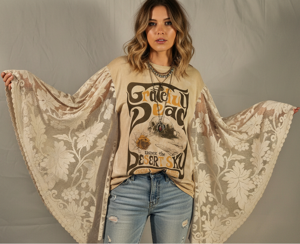 Woman wearing a graphic sweatshirt with a floral shawl over her shoulders against a plain background