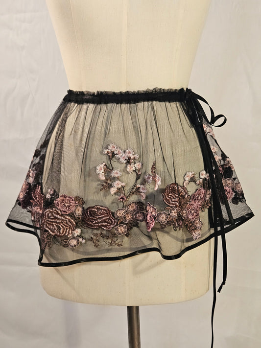 Short black mesh skirt with pink floral embroidery