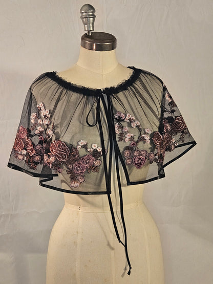 Short black mesh cape with pink floral embroidery