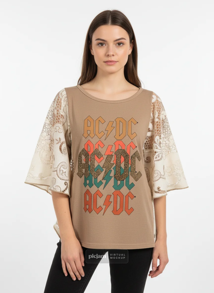 Woman wearing a beige AC/DC t-shirt with lace sleeves on a white background