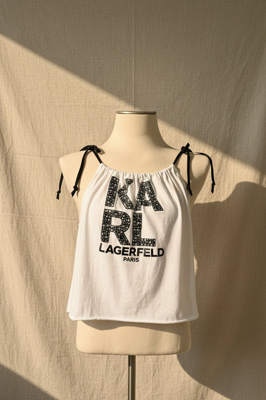 White tank top with 'Karl Lagerfeld' print on a mannequin against a beige background