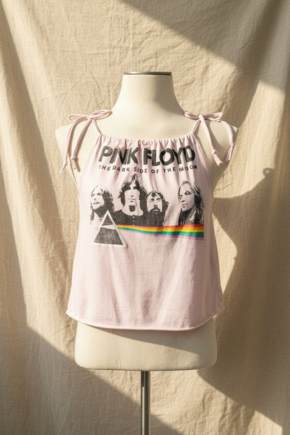 Pink Floyd tank top on a mannequin against a beige curtain