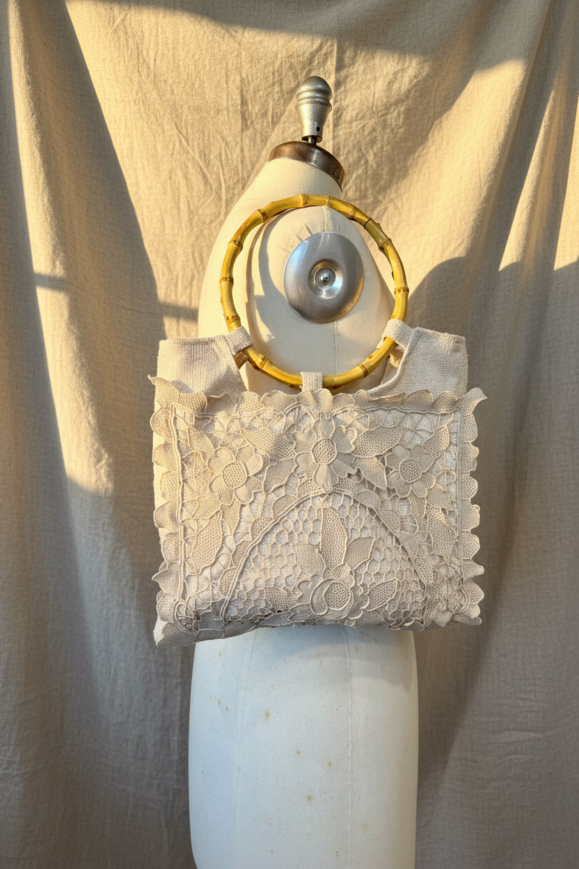 Vintage-style purse with lace  on a white background