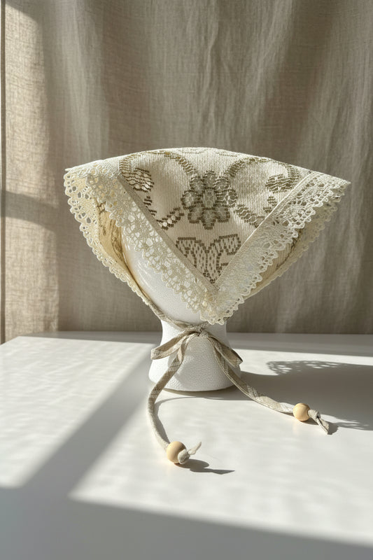 Back view of ivory & tan floral lace head scarf made from a reclaimed table cloth with lace trim.