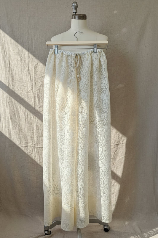 Lace pants on a mannequin against a neutral background