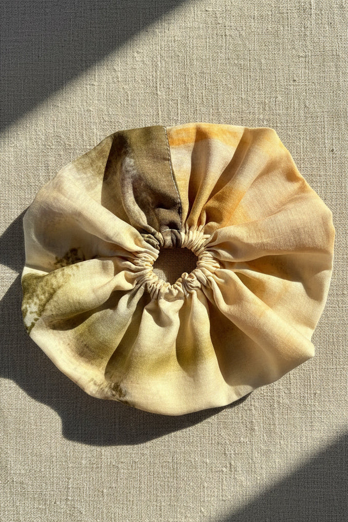 Beige fabric pouch on a textured beige background